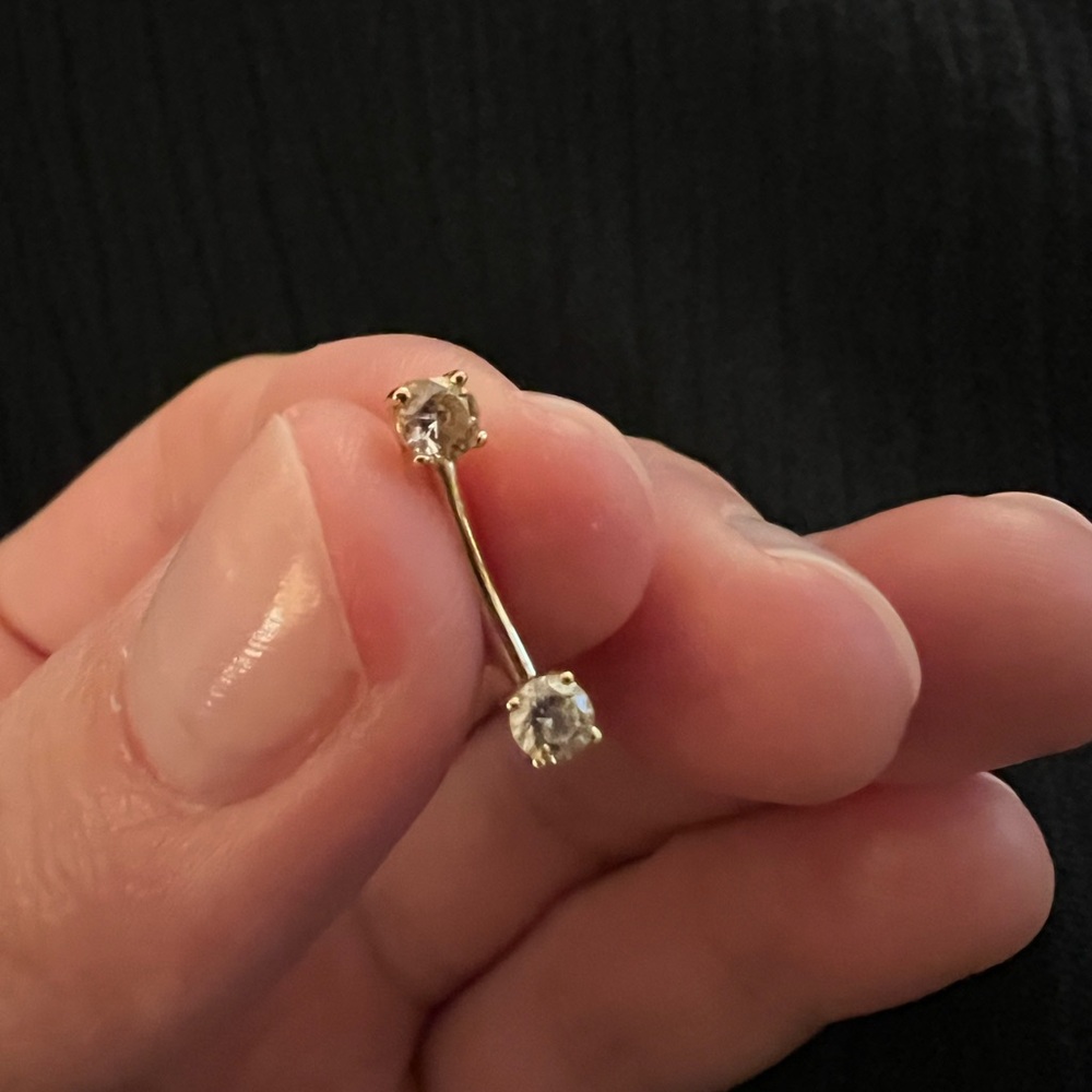 Solid gold and cubic zirconia rook piercing